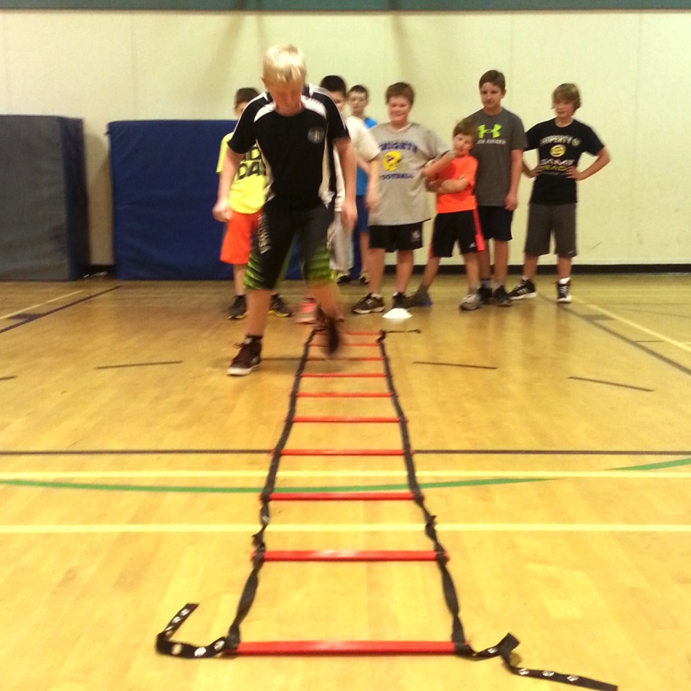 kids doing ladders at camp